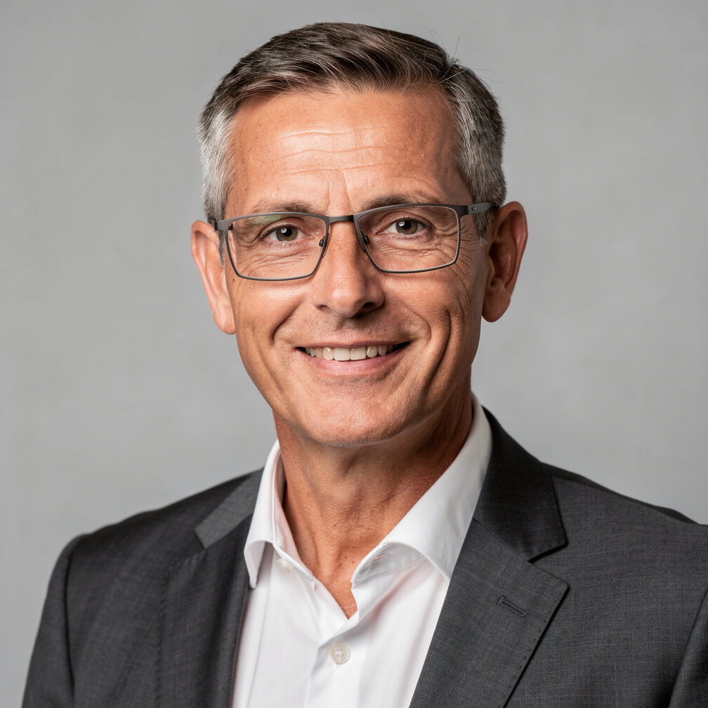 Studio portrait of a Belgian businessman with glasses